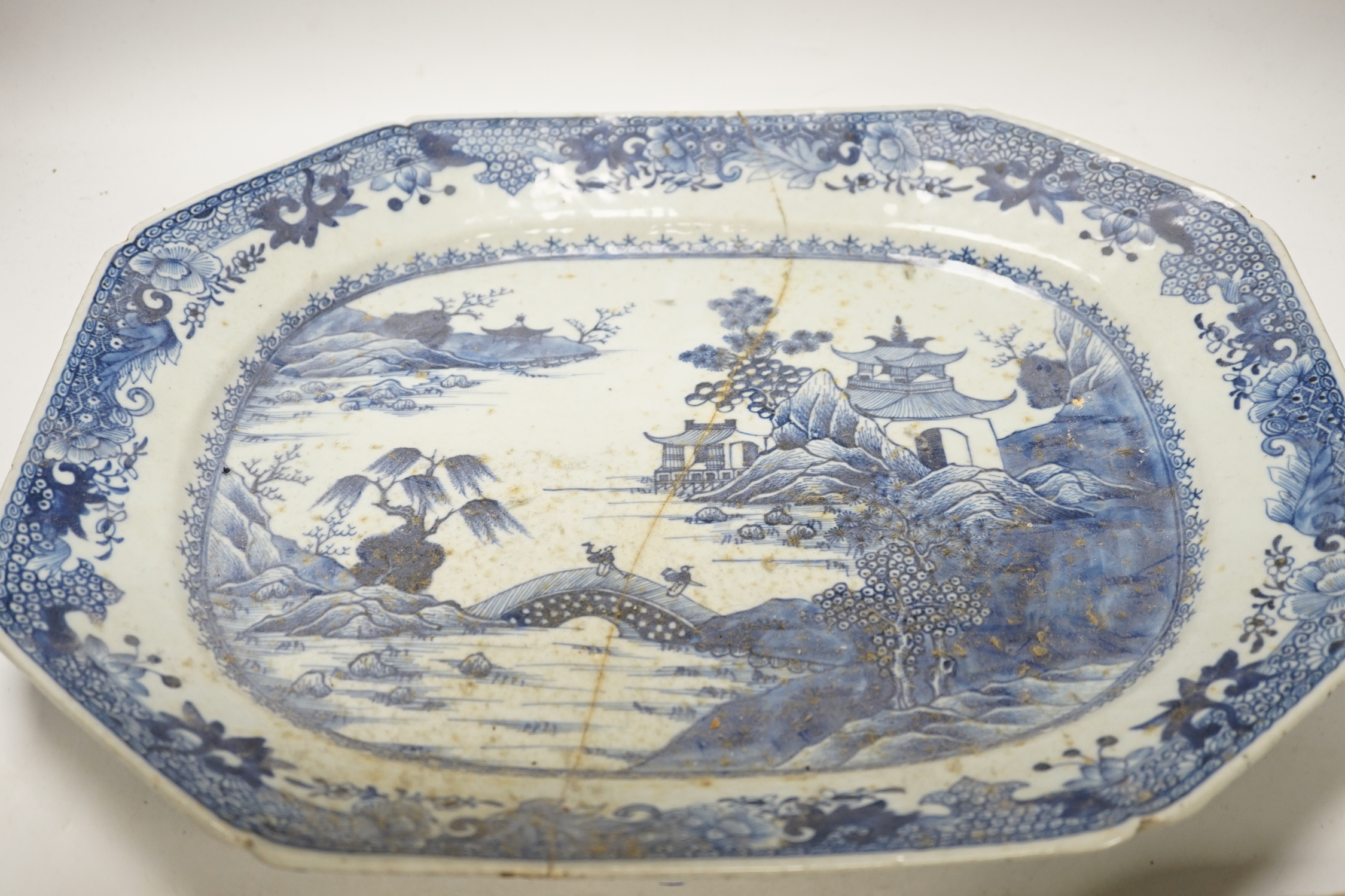 Three 18th century Chinese blue and white export dishes, largest 46x39cm